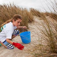 Volunteers of all ages pitch in to help keep our local beaches clean.